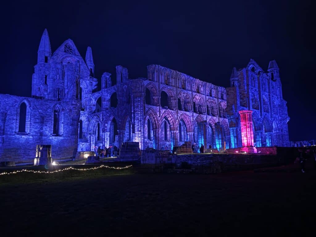 illuminated abbey whitby • Little Vikings - York for Kids Whitby Abbey ruins glowing with dramatic lighting during the illuminated event in autumn