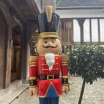 York Nutcracker Trail - Nutcracker statue in front of York’s historic streets at Christmas