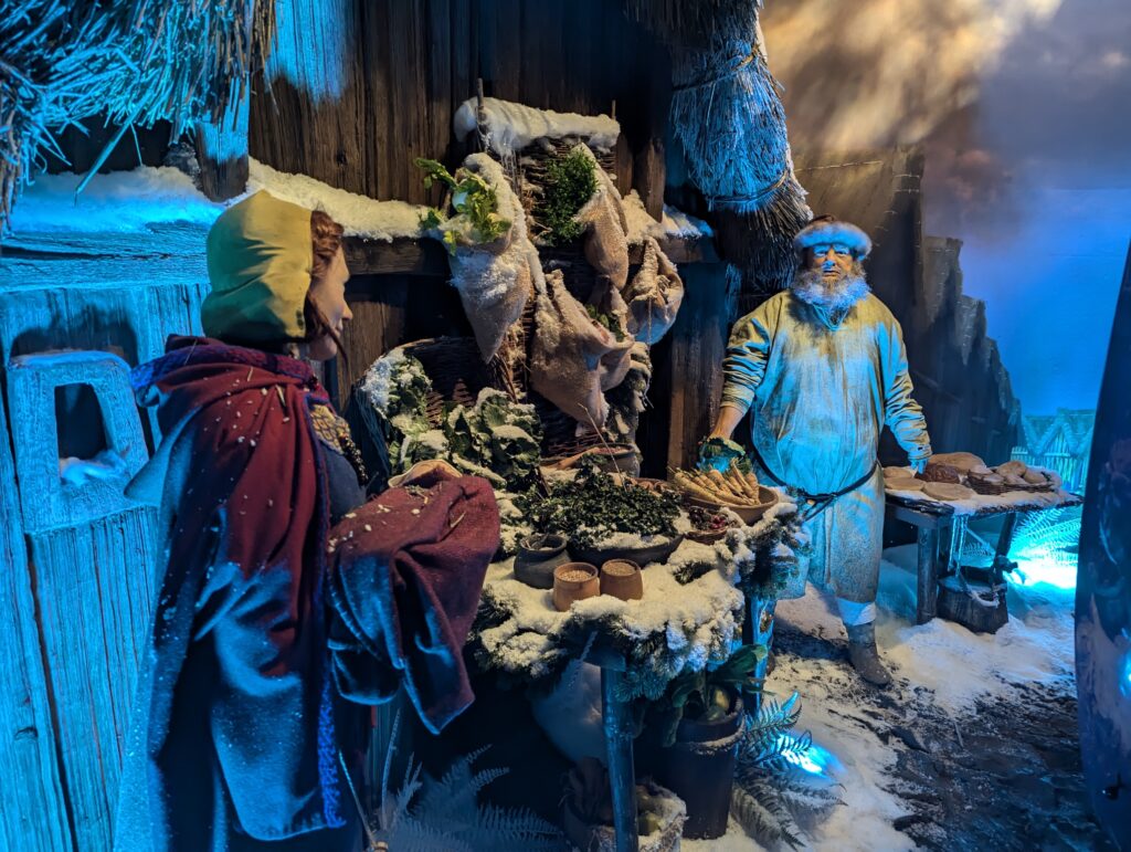 PXL_20241110_162555367 • Little Vikings - York for Kids Snow-covered Viking village scene at JORVIK Viking Centre during A Winter Adventure, York.