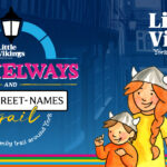 Families exploring York’s hidden snickelways using the Little Vikings Snickelways & Silly Street Names Trail illustrated map.