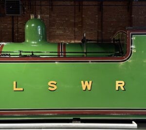 Families enjoying October half-term fun at the National Railway Museum in York — exploring restored Royal carriages in Station Hall, taking part in hands-on experiments in Wonderlab, and meeting the ghost of George Stephenson for spooky storytelling adventures.